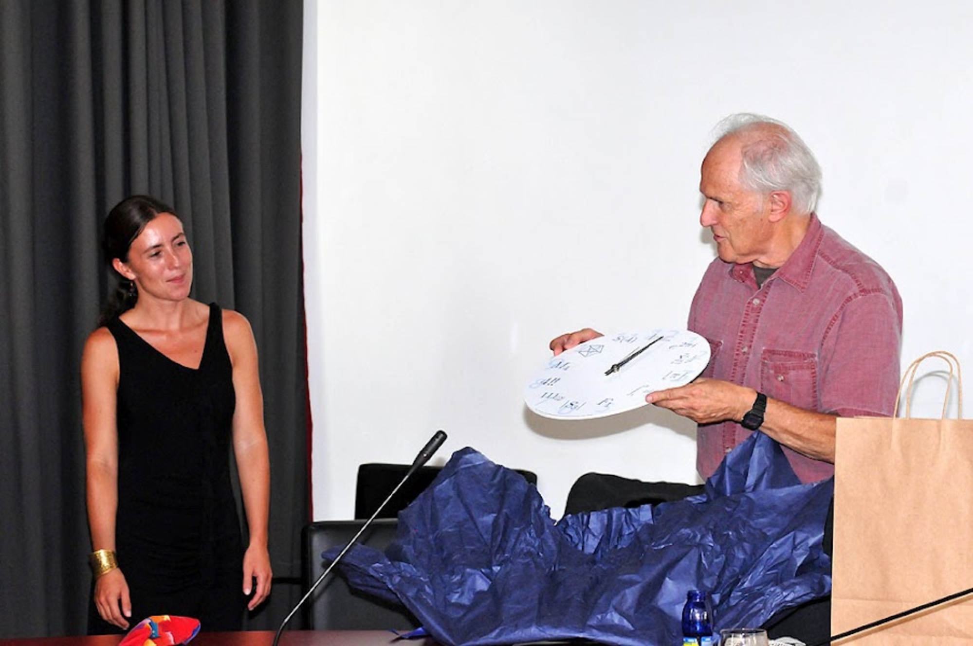 Dean of UP FAMNIT, Assist. Prof. Dr. Klavdija Kutnar, presents Prof. Dr. Sir Harold Kroto with a mathematical clock from UP FAMNIT after a formal reception hosted by the Rector of the University of Primorska, Prof. Dr. Dragan Marušič, (Koper, 24 August 2012)